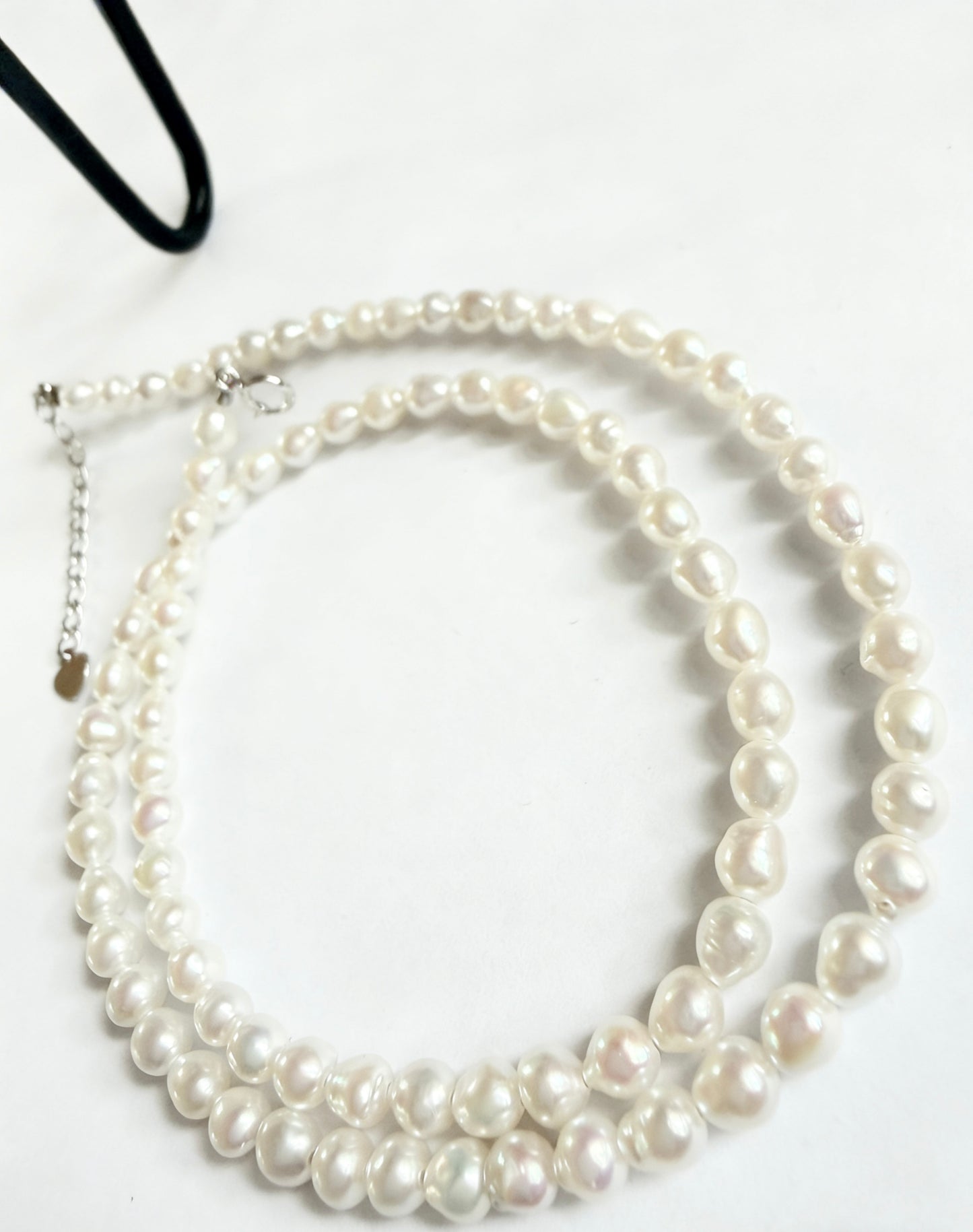 Baroque freshwater pearl necklace with 3-4mm soft white seed pearls and 925 sterling silver clasp.
