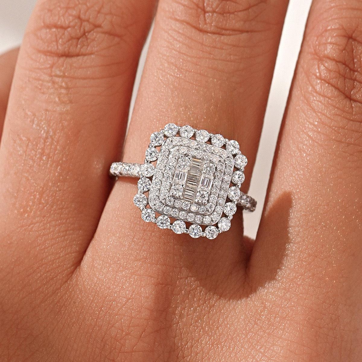 Square double halo moissanite ring with baguette cluster, D color, S925 silver, on a hand.