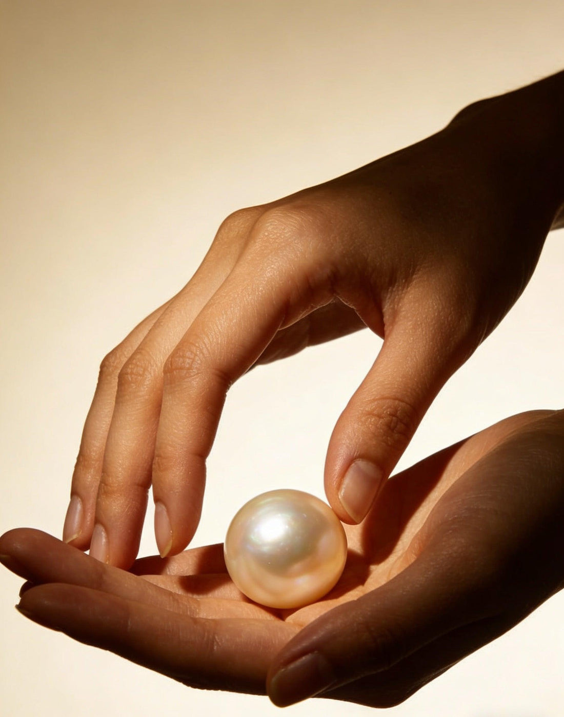 freshwater pearl in hand showing natural pearl beauty