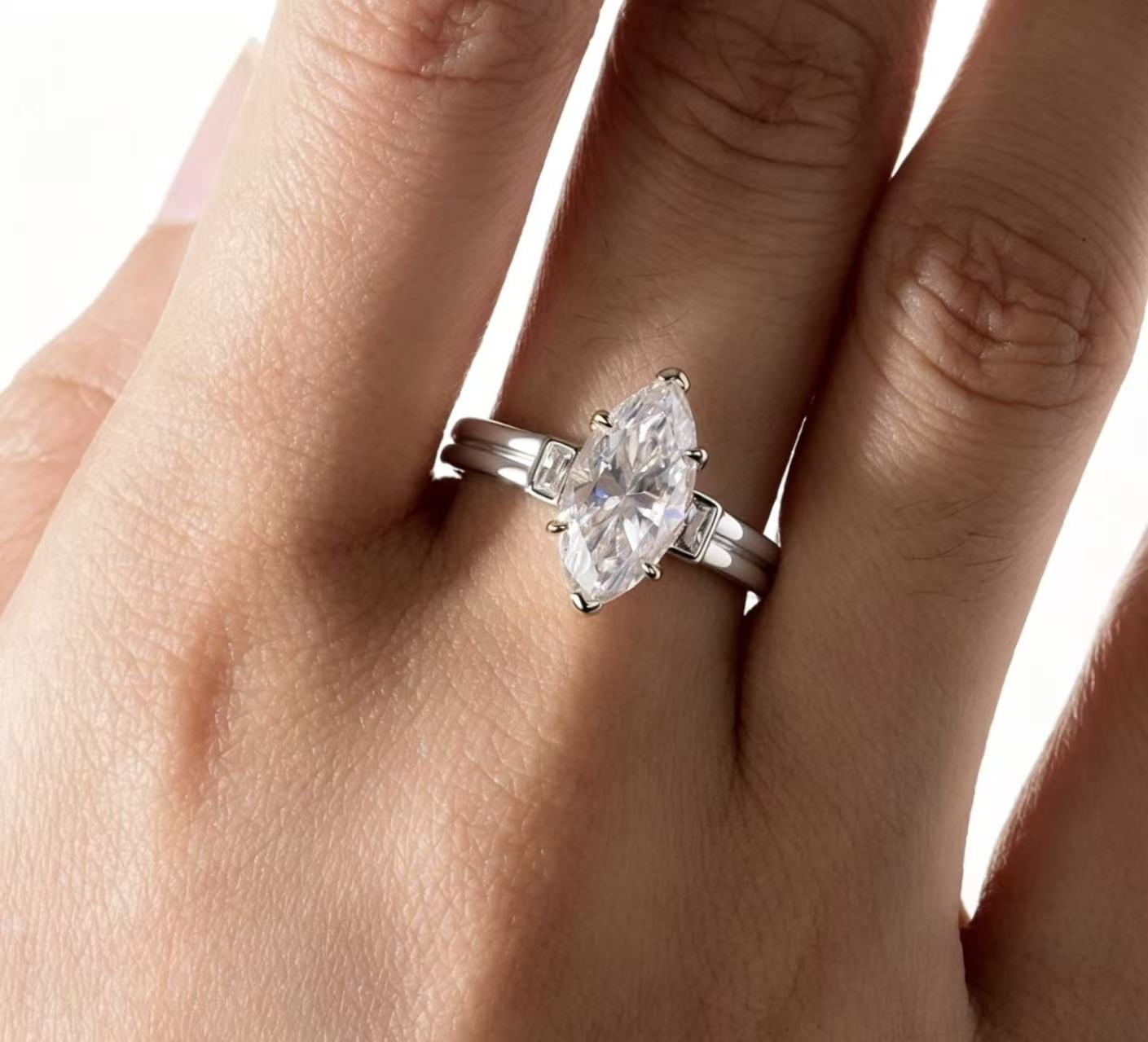 Marquise Moissanite engagement ring on a hand, 3.0ct D color VVS1, S925 sterling silver 18K gold plated.