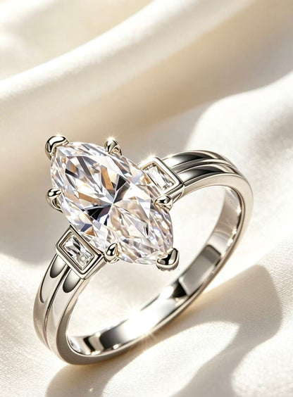 Silver "Three Lives" marquise moissanite engagement ring with 3.0ct D color VVS1 main stone and baguette side stones.