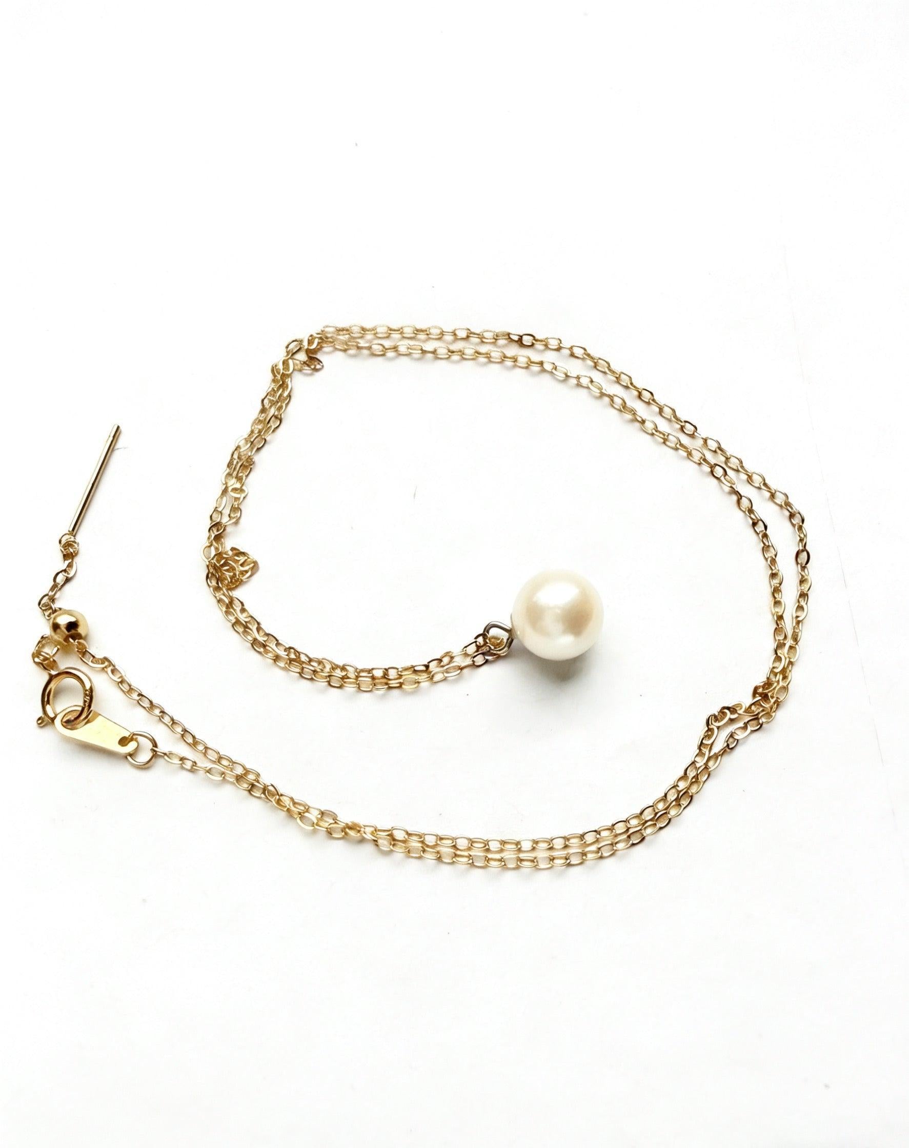 7mm Hepu saltwater pearl pendant necklace with a gold-plated chain on a white background.