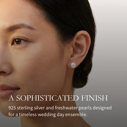 Woman wearing a single 7mm white South Sea pearl stud earring with a sterling silver post.