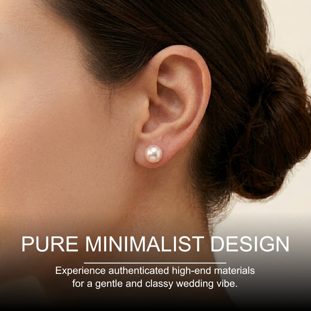 Woman wearing a single 7mm round white South Sea pearl stud earring with a soft luster.