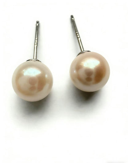 Pair of Luvymia 7mm natural South Sea pearl stud earrings with sterling silver posts.