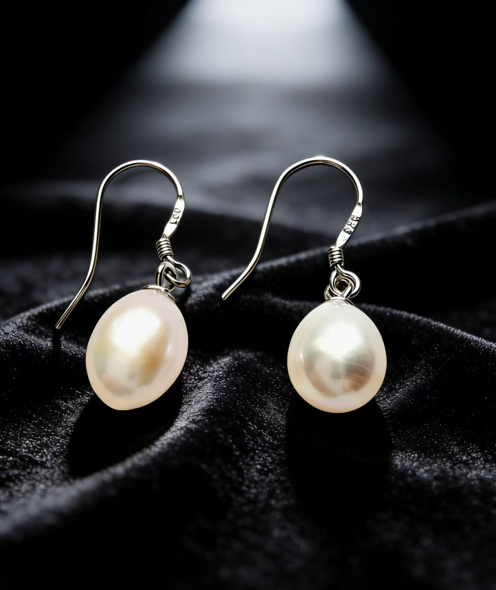 Baroque freshwater pearl drop earrings with natural white 7-8mm pearls and 925 sterling silver hooks.