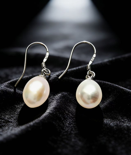 Baroque freshwater pearl drop earrings with natural white 7-8mm pearls and 925 sterling silver hooks.