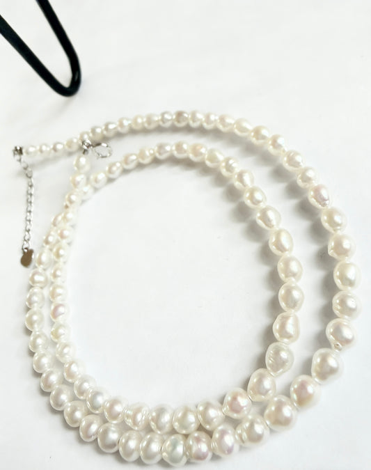 Luvymia baroque freshwater pearl necklace with 3-4mm soft white seed pearls and 925 sterling silver clasp.