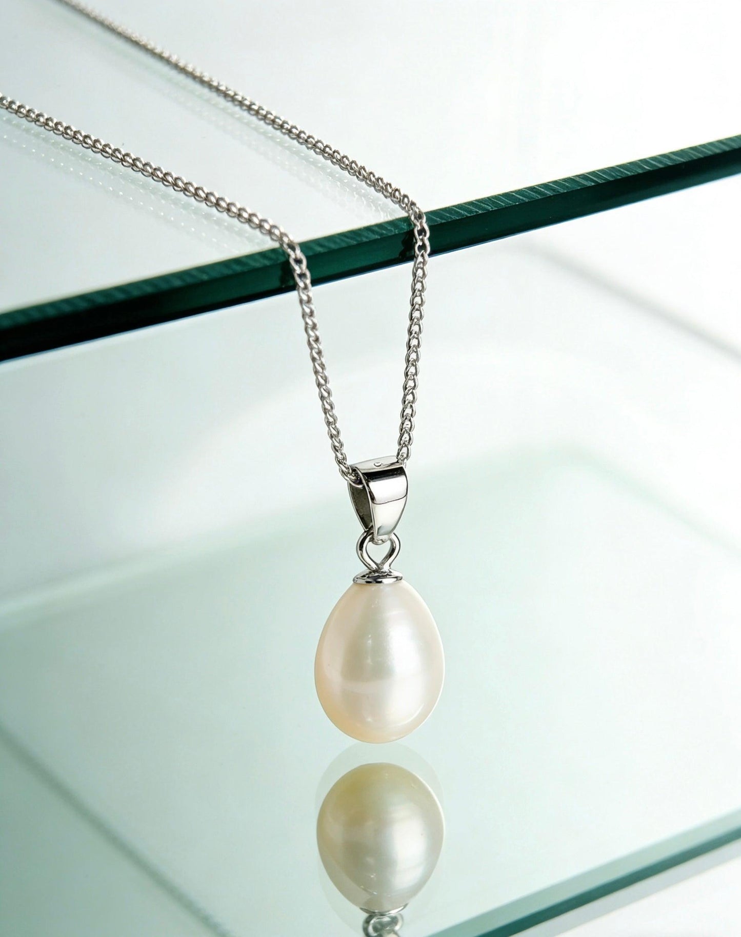 Baroque freshwater pearl pendant necklace with a cream-white pearl and 925 sterling silver chain.