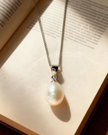 Baroque freshwater pearl pendant necklace with a cream-white luster on a delicate 925 sterling silver chain.