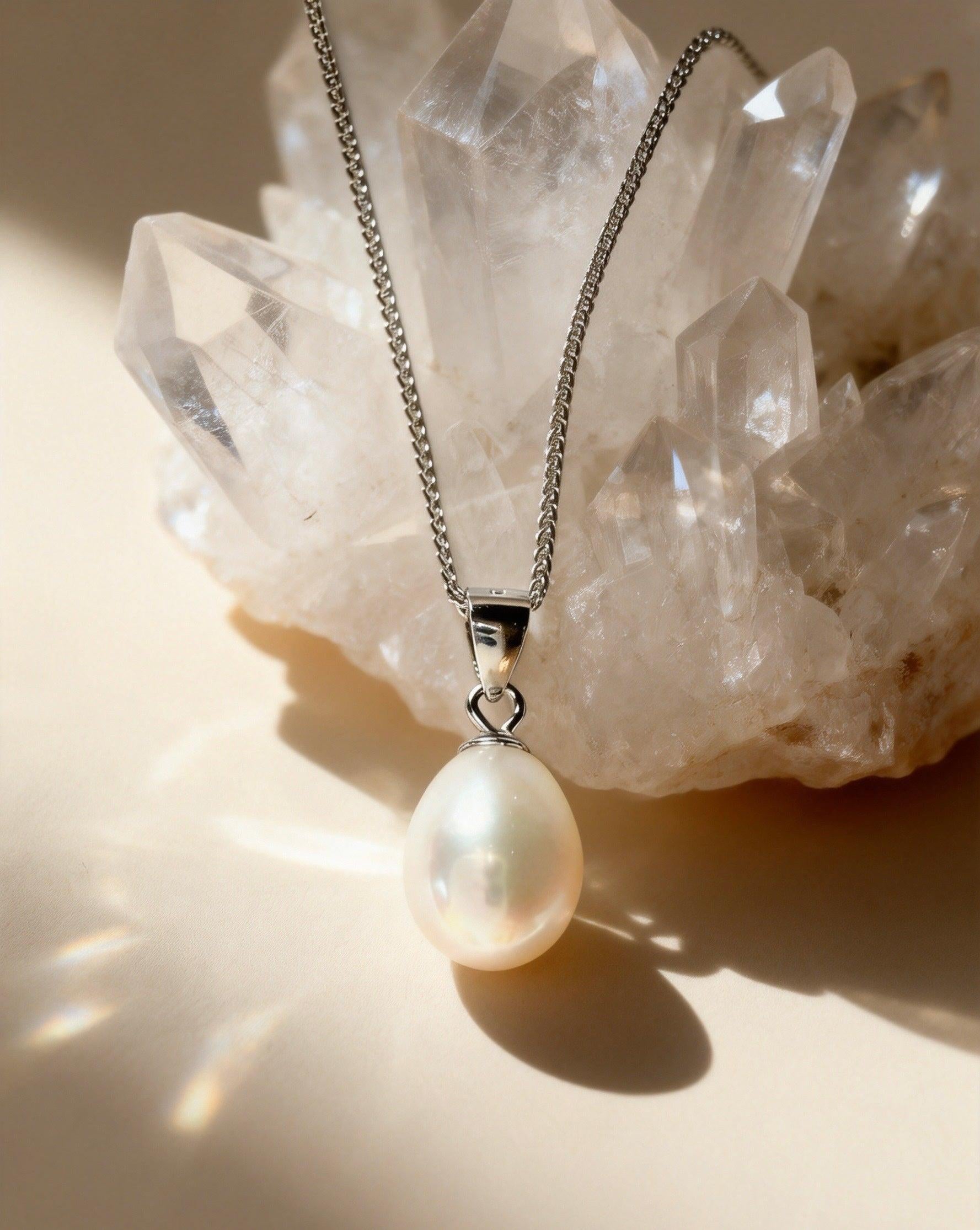 Baroque freshwater pearl pendant necklace with a cream-white pearl on a delicate 925 sterling silver chain.