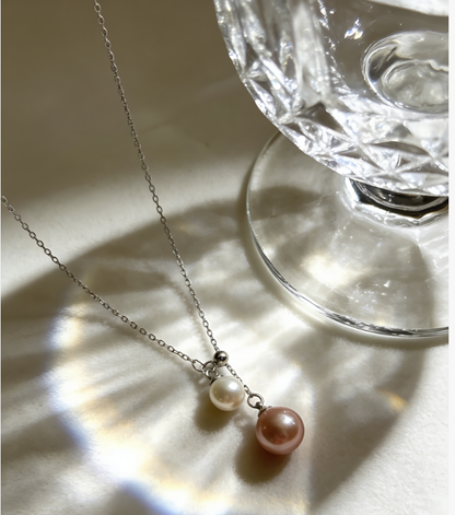 Luvymia double freshwater pearl necklace with 6-7mm peach pink and 4-5mm white pearls on a sterling silver chain.