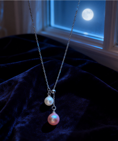 925 sterling silver necklace with a 6-7mm peach pink and 4-5mm white double freshwater pearl pendant.