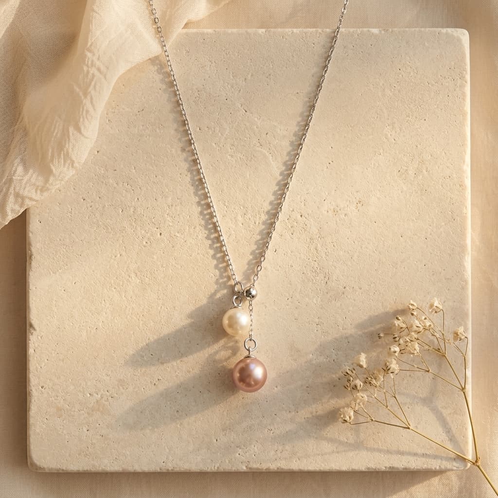 925 sterling silver necklace with a 6-7mm peach pink and 4-5mm white double freshwater pearl pendant.