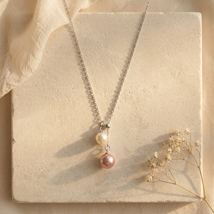 925 sterling silver necklace with a 6-7mm peach pink and 4-5mm white double freshwater pearl pendant.
