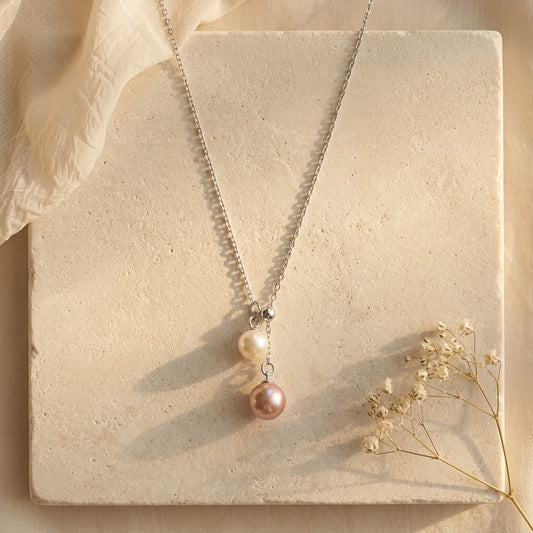 925 sterling silver necklace with a 6-7mm peach pink and 4-5mm white double freshwater pearl pendant.