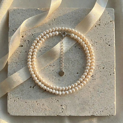 Minimalist Luvymia 3-4mm near-round freshwater pearl necklace with 925 sterling silver clasp and heart charm.