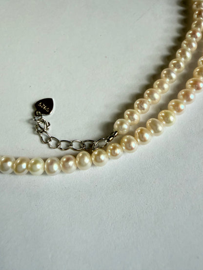 Minimalist 3-4mm round freshwater pearl necklace with 925 sterling silver heart clasp and extender chain.