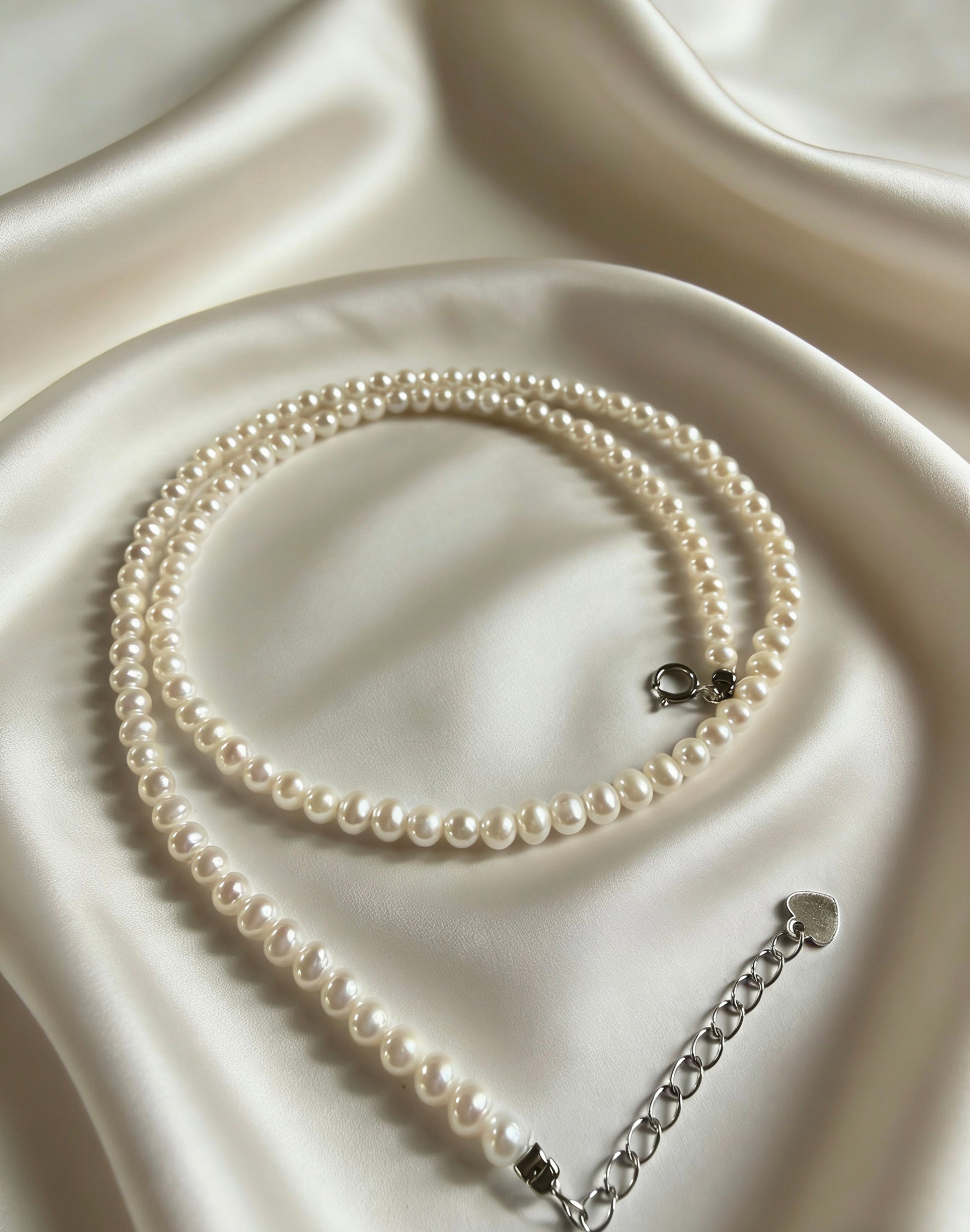 Minimalist Luvymia 3-4mm near-round freshwater pearl necklace with 925 sterling silver clasp on satin.