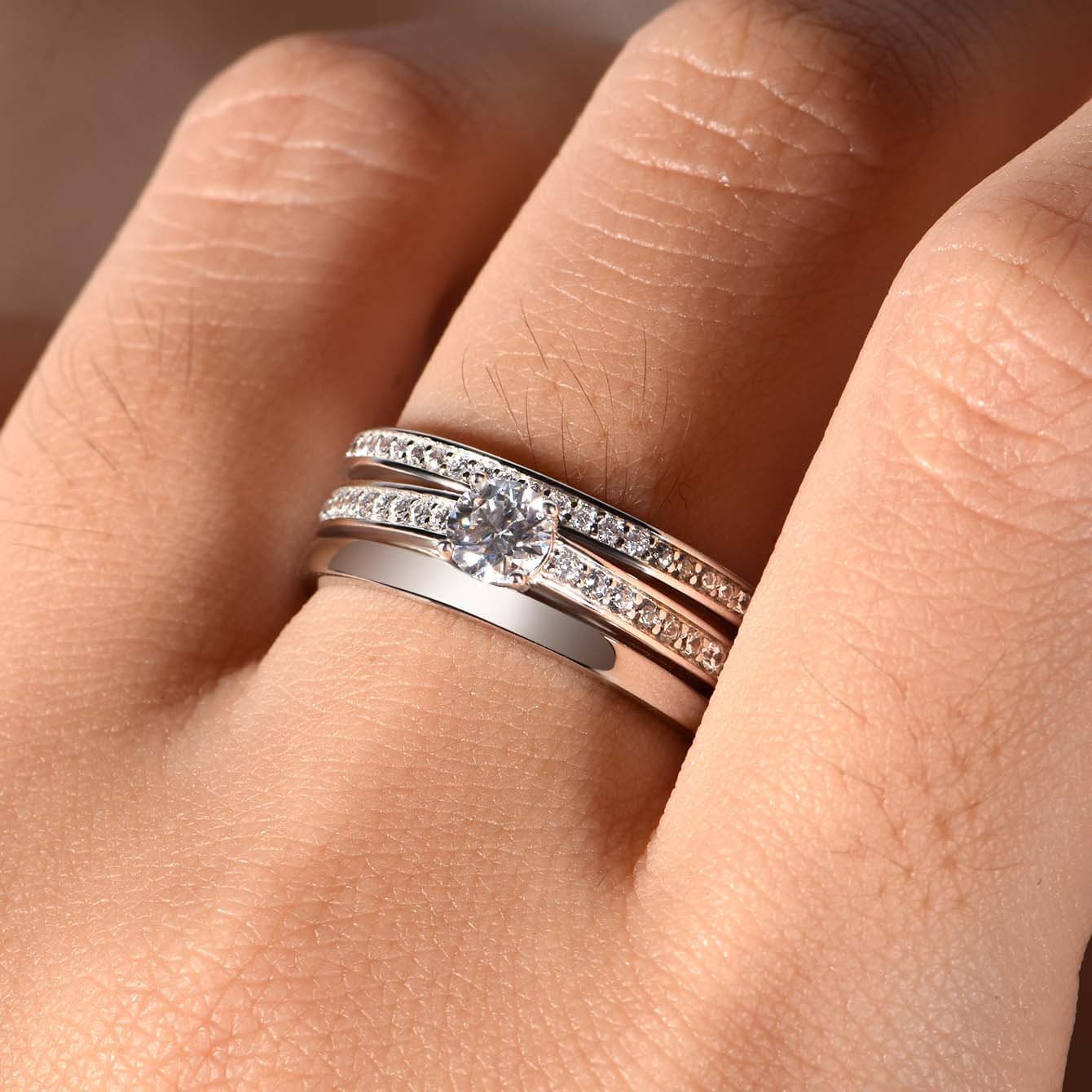 Men's S925 silver wedding ring with 0.4ct moissanite center stone and double pavé rails on a wide band.