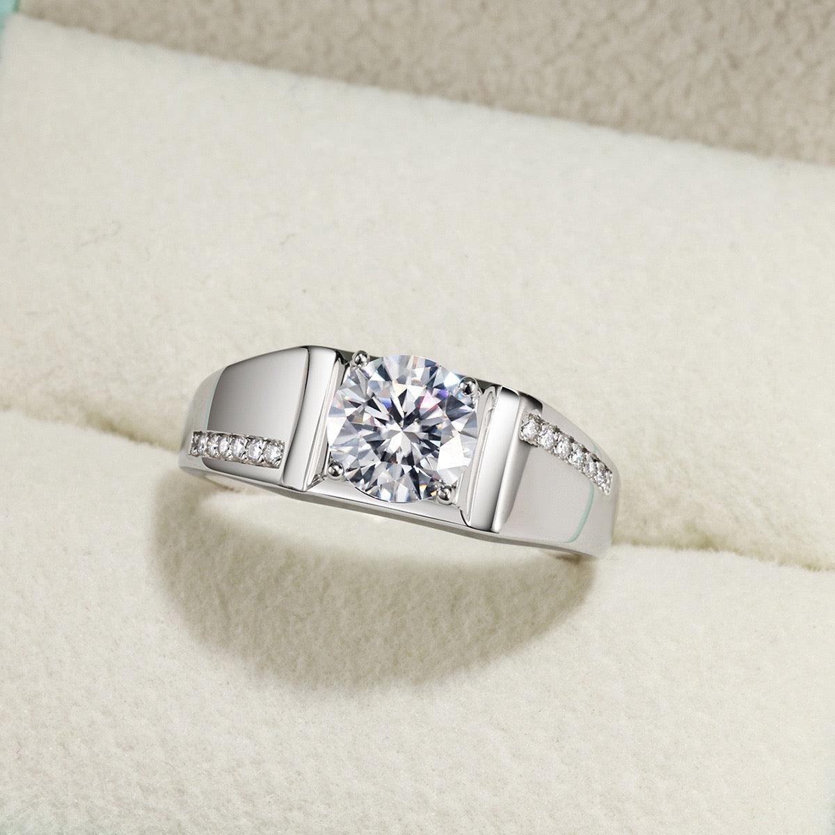 Men's S925 silver wedding ring with a 1ct round brilliant moissanite and pavé accent stones.