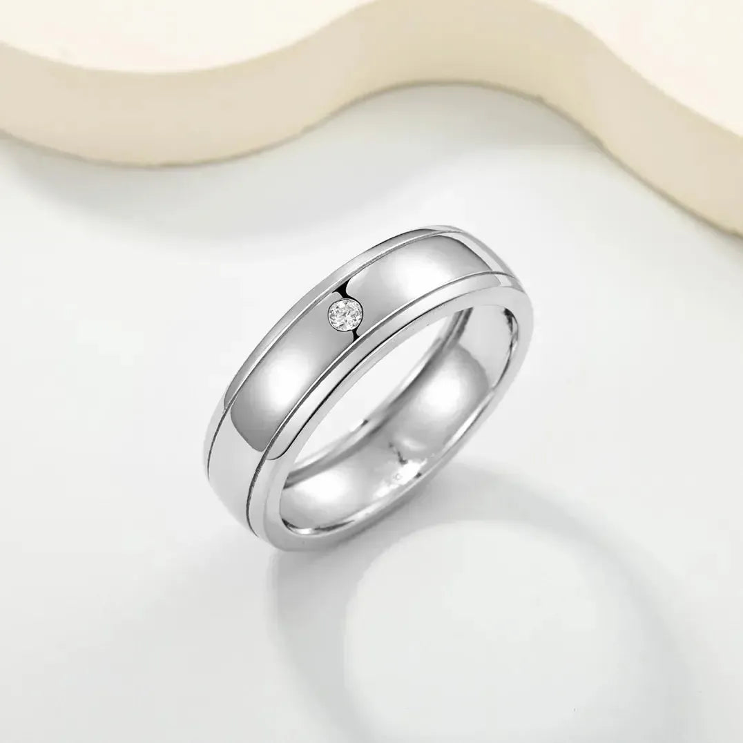 Men's minimalist S925 silver wedding ring with a single D-color moissanite and double rail design.