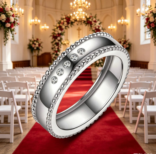 Men's wide S925 silver moissanite wedding ring with beaded edges on a red aisle.